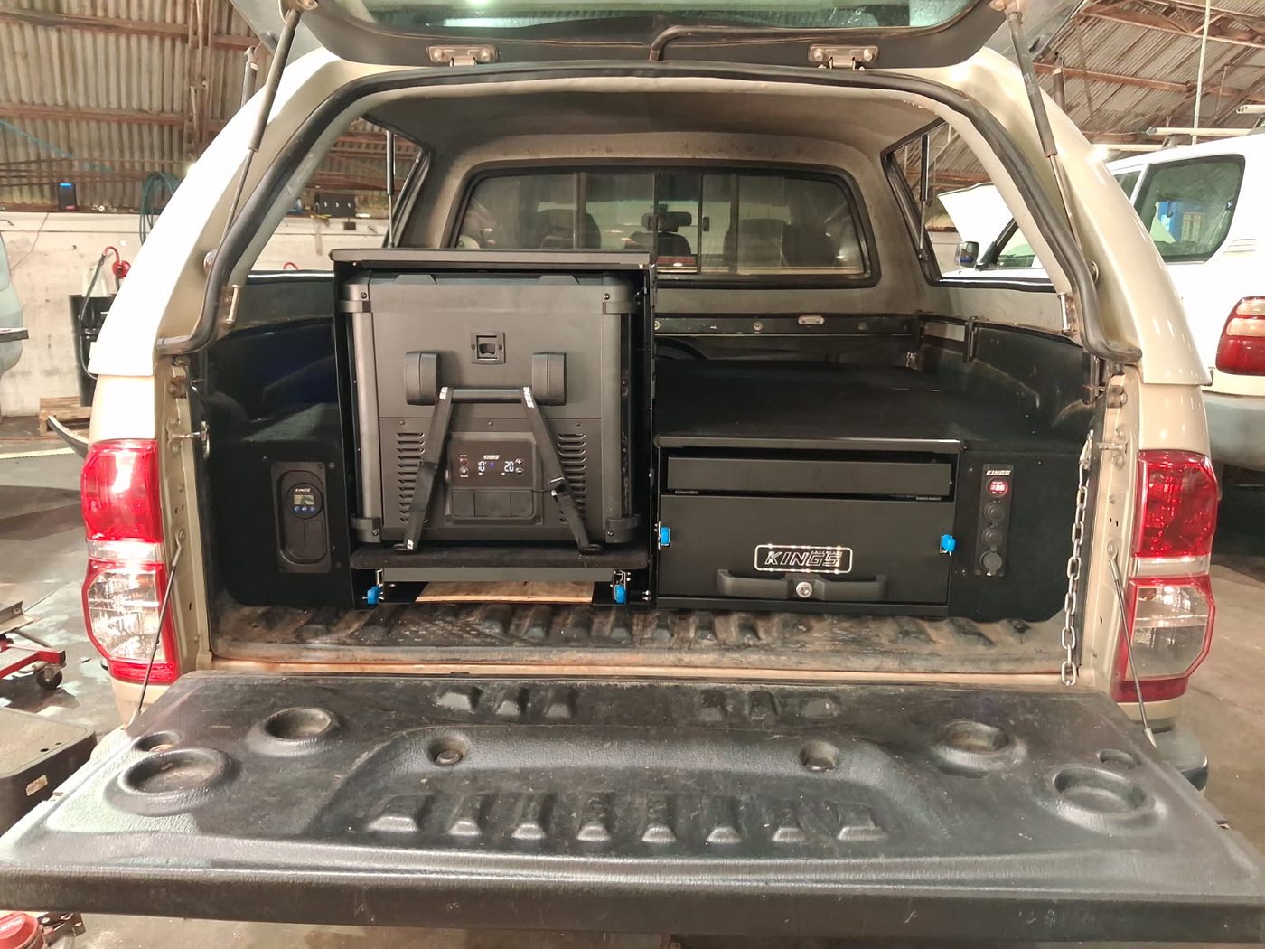 Fridge slide and lockable drawer system fitted in the back of a 4WD ute